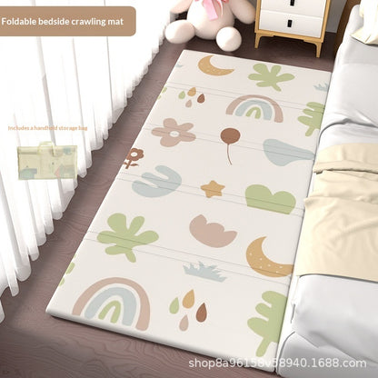HOMCOM foldable baby crib side mat for protection, shown in a living room setting with soft padding and easy fold design.