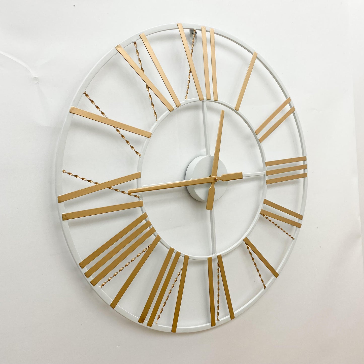 MSL 60cm wall clock with black frame and white face, featuring large black numerals and minimalist design.