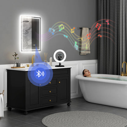 HOMCOM 50x70cm silver anti-fog LED bathroom mirror with Bluetooth, clock, and modern design, featuring built-in lighting and reflective surface.