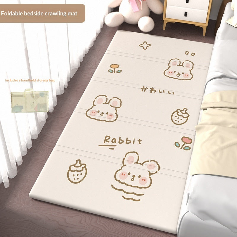 HOMCOM foldable baby crib side mat for protection, shown in a living room setting, with soft cushioning and easy fold design.