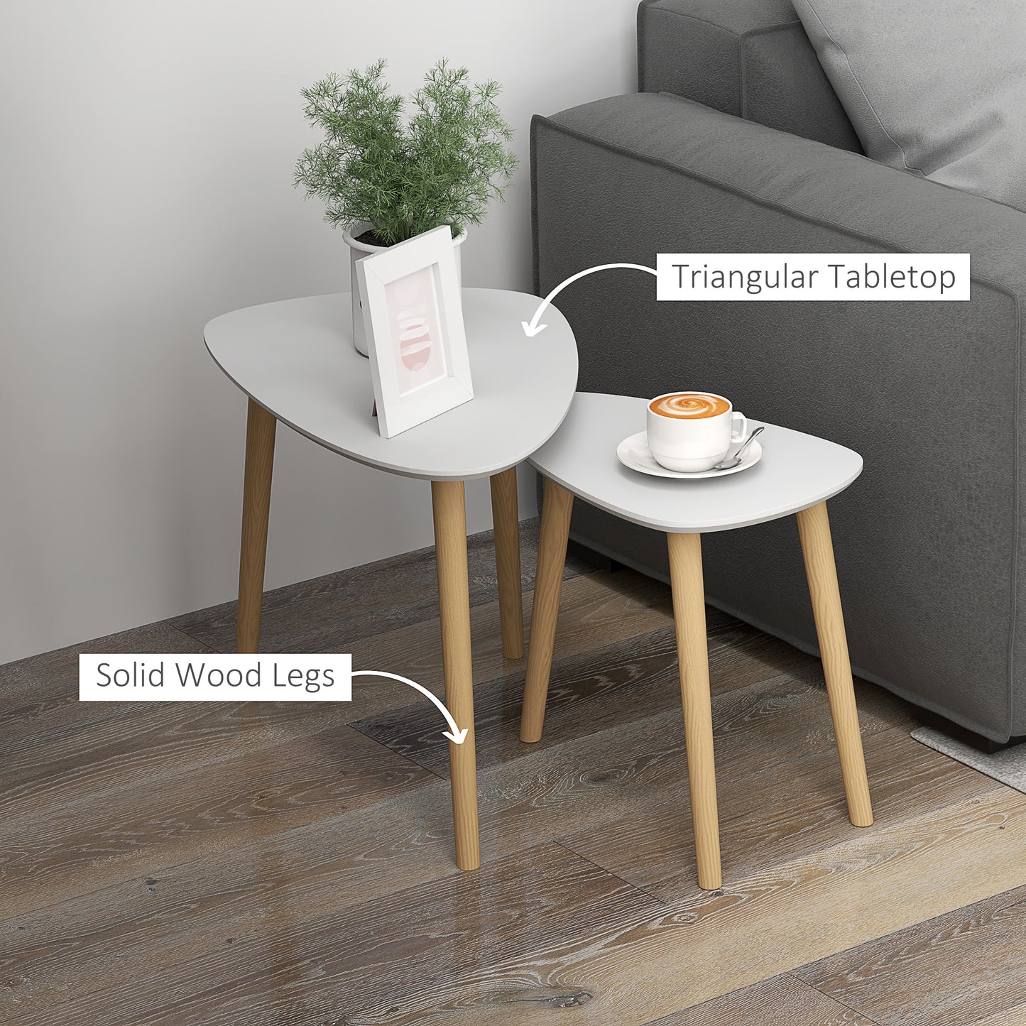 Pair of HOMCOM nesting coffee tables with light grey surfaces and solid wood legs, stacking end tables for living room or bedroom use.