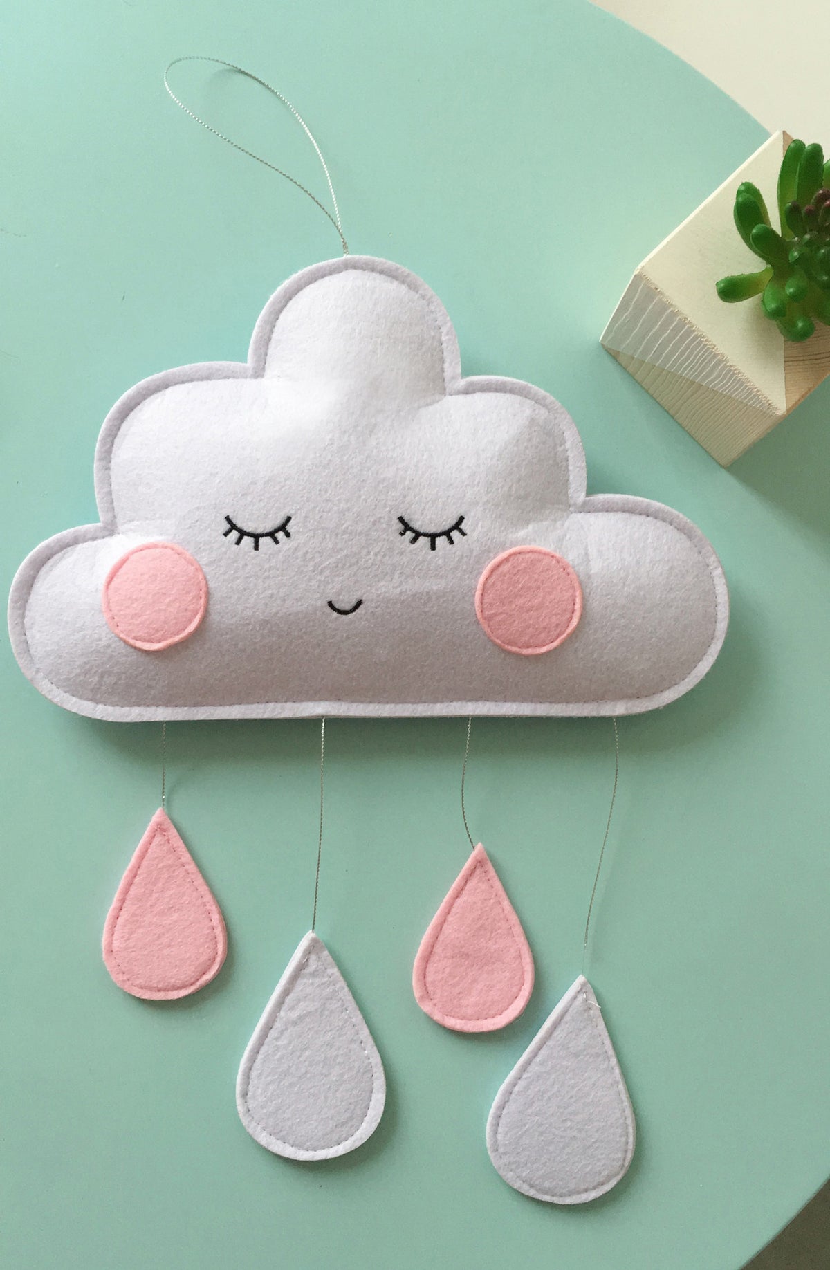 Eprolo Clouds Felt Raindrops Pendant hanging decoration for kids' room with soft cloud and raindrop design.