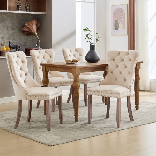 Set of 4 beige velvet dining chairs with button tufted design and wooden legs, modern style by eprolo.