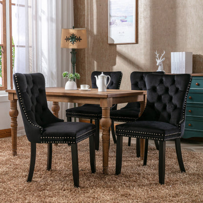 Set of 4 beige modern velvet dining chairs with button tufted seats and wooden legs, stylish and comfortable for dining rooms.