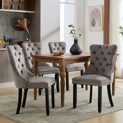Set of 4 beige modern velvet dining chairs with button tufted design and wooden legs, stylish and comfortable for dining rooms.
