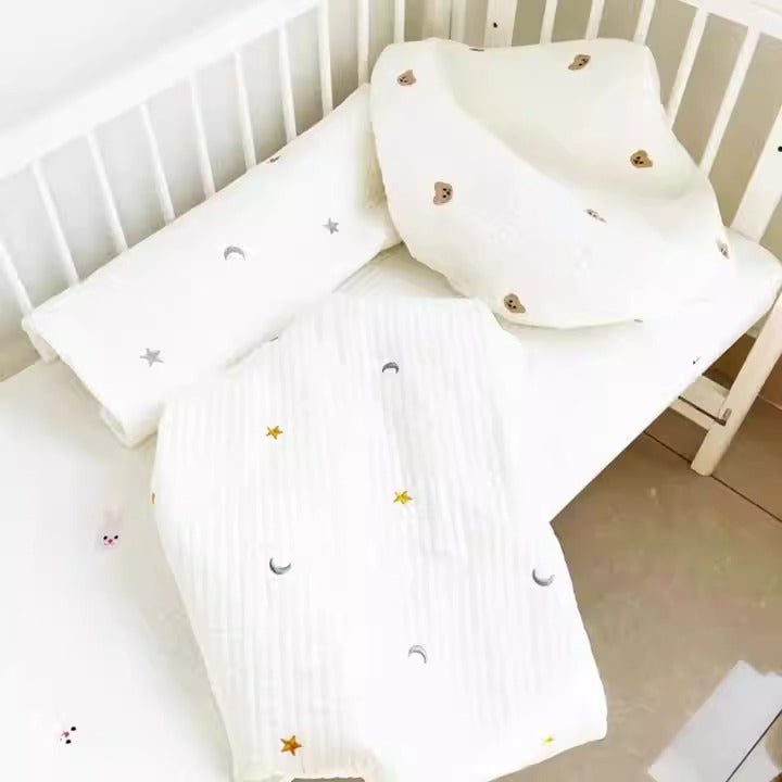 Baby fitted sheet by eprolo with quilted cotton fabric and embroidered bear head design, suitable for crib bedding.