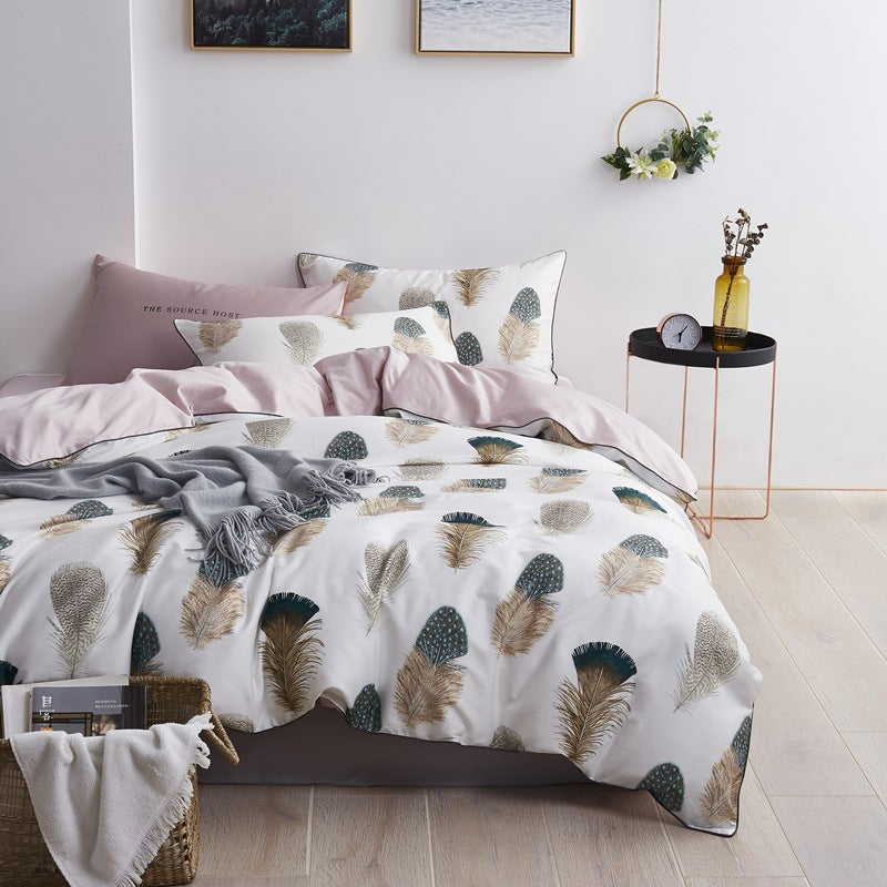 American style four-piece cotton bed set by HOMCOM, featuring a cozy bed with plush bedding and decorative pillows.