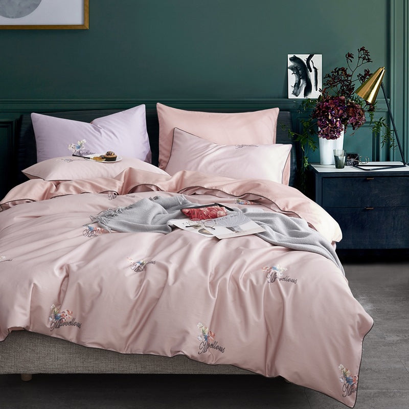 American style four-piece cotton bed by HOMCOM with a sturdy frame and plush bedding for a modern bedroom look.
