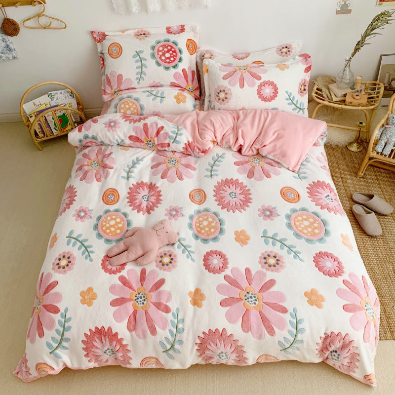 HOMCOM thick and warm snow fleece four-piece cartoon bedding set with cozy fleece material and colorful snow-themed designs.