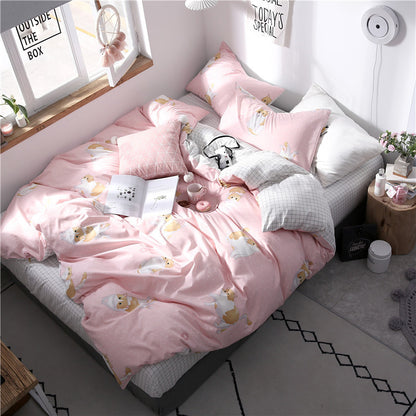 Grey HOMCOM four-piece cotton bedding set with pillowcases and duvet cover, soft and comfortable for a cozy bedroom.