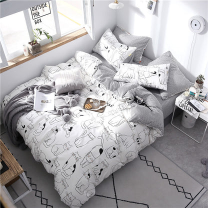 Grey four-piece cotton bedding set from HOMCOM with matching pillowcases and duvet cover, soft and comfortable for bedroom.