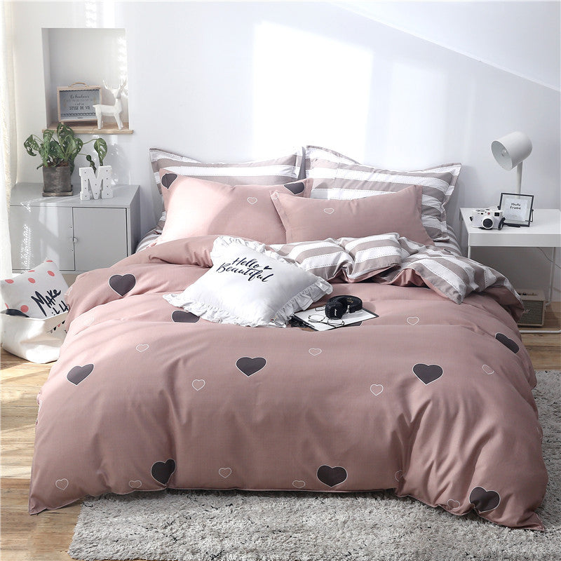 HOMCOM single bed quilt bedding set with a heartbeat pattern, includes duvet cover and pillowcases in a cozy bedroom setting.