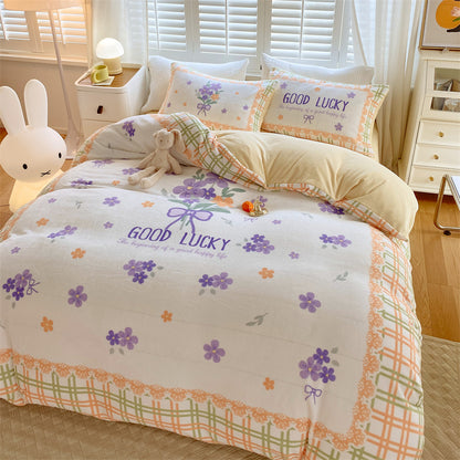HOMCOM cute cartoon milk velvet bedding set of four with dinosaur and animal designs on soft, colorful bed sheets for kids.