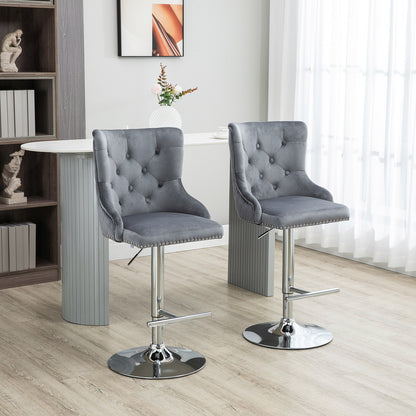 Set of 2 grey velvet HOMCOM bar stools with adjustable height, swivel feature, and tufted backrest for modern breakfast bar seating.