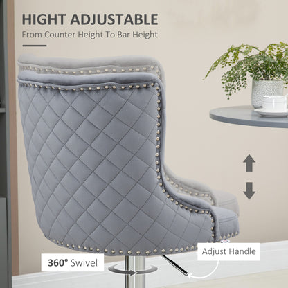 Set of 2 grey velvet bar stools by HOMCOM with tufted backrest, adjustable height, and swivel function for breakfast bar seating.
