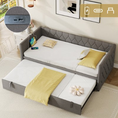 Grey upholstered HOMCOM daybed with pull-out trundle and built-in USB charging station, featuring a linen sofa bed design.
