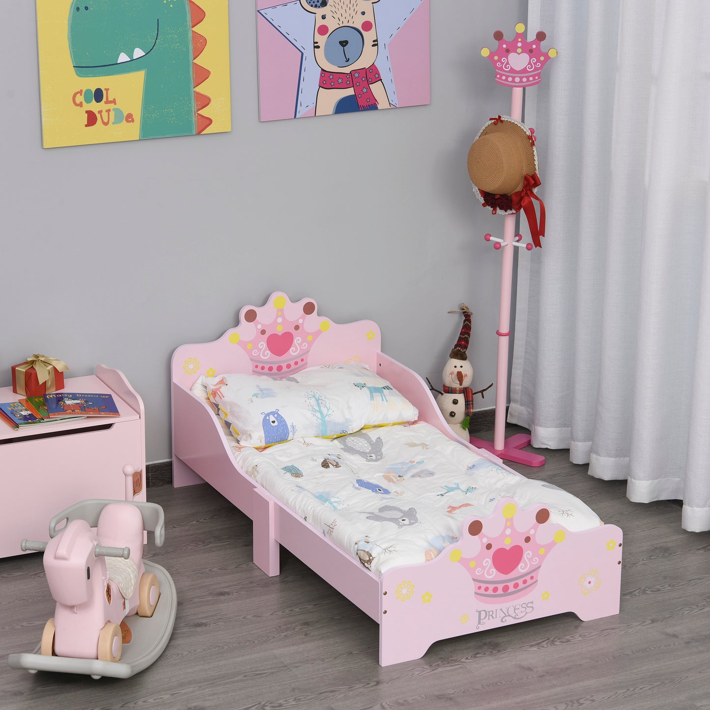 Pink kids toddler bed with princess crown theme, safety side rails, slats, suitable for boys and girls aged 3-6 years.