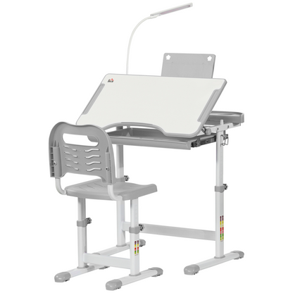 Kids study desk and chair set by HOMCOM with adjustable height, grey color, USB lamp, ideal for children’s learning space.