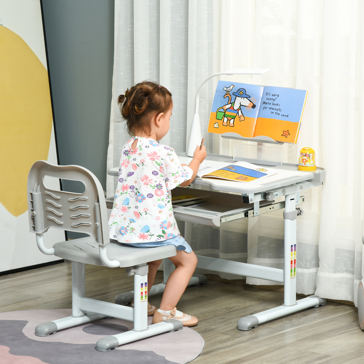 Grey kids study desk and chair set by HOMCOM with adjustable height and USB lamp, ideal for young students.