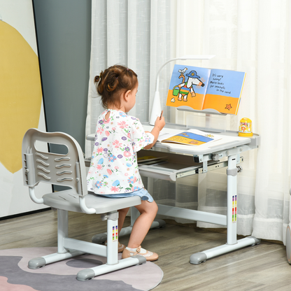 Grey kids study desk and chair set by HOMCOM with adjustable height and USB lamp, ideal for young students.