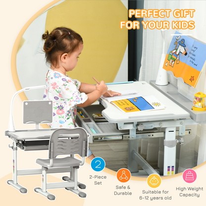Kids study desk and chair set by HOMCOM with USB lamp, adjustable height, in grey, suitable for children’s learning space.