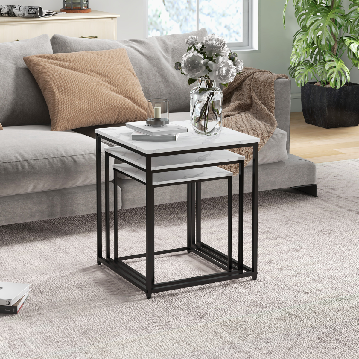 Set of three white HOMCOM nesting coffee tables with sleek modern design, perfect for living room decor and space-saving functionality.