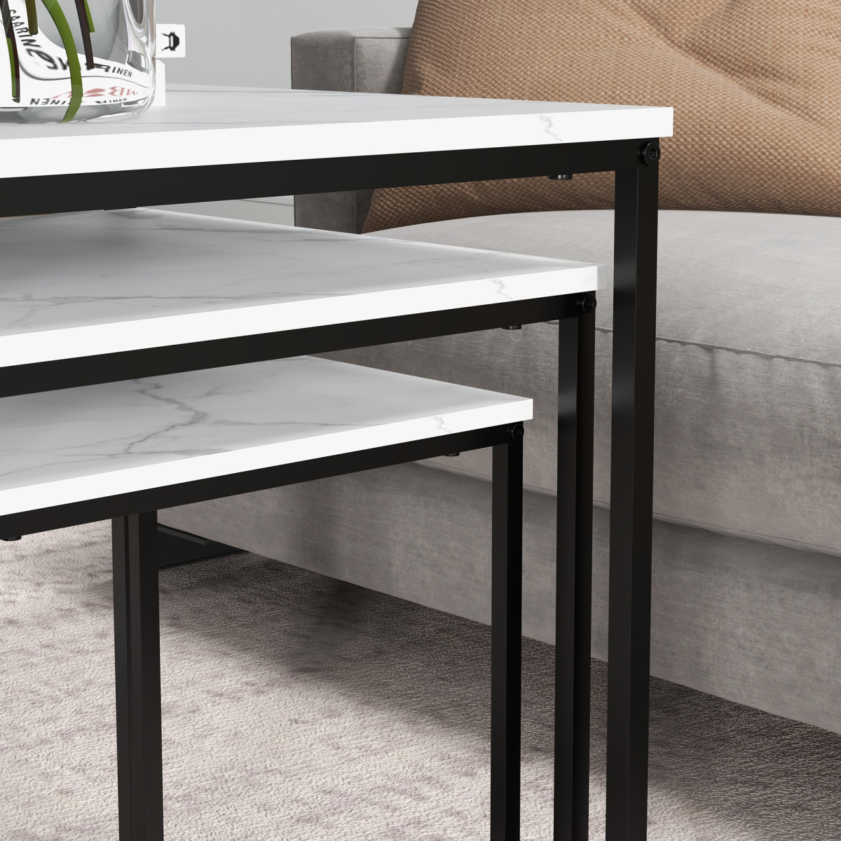 Set of three white HOMCOM nesting coffee tables with sleek modern design, ideal for living room decor and space-saving functionality.