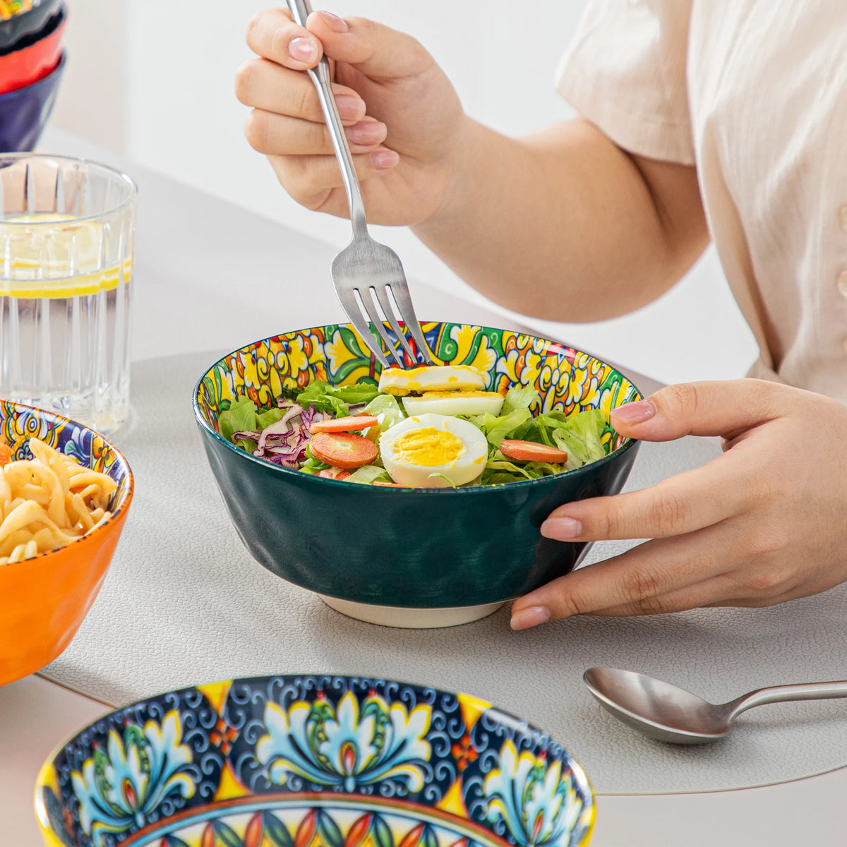 Livoshop 24-piece ceramic dinnerware set with bohemian stoneware design, includes dinner plates, dessert plates, cereal and pasta bowls.