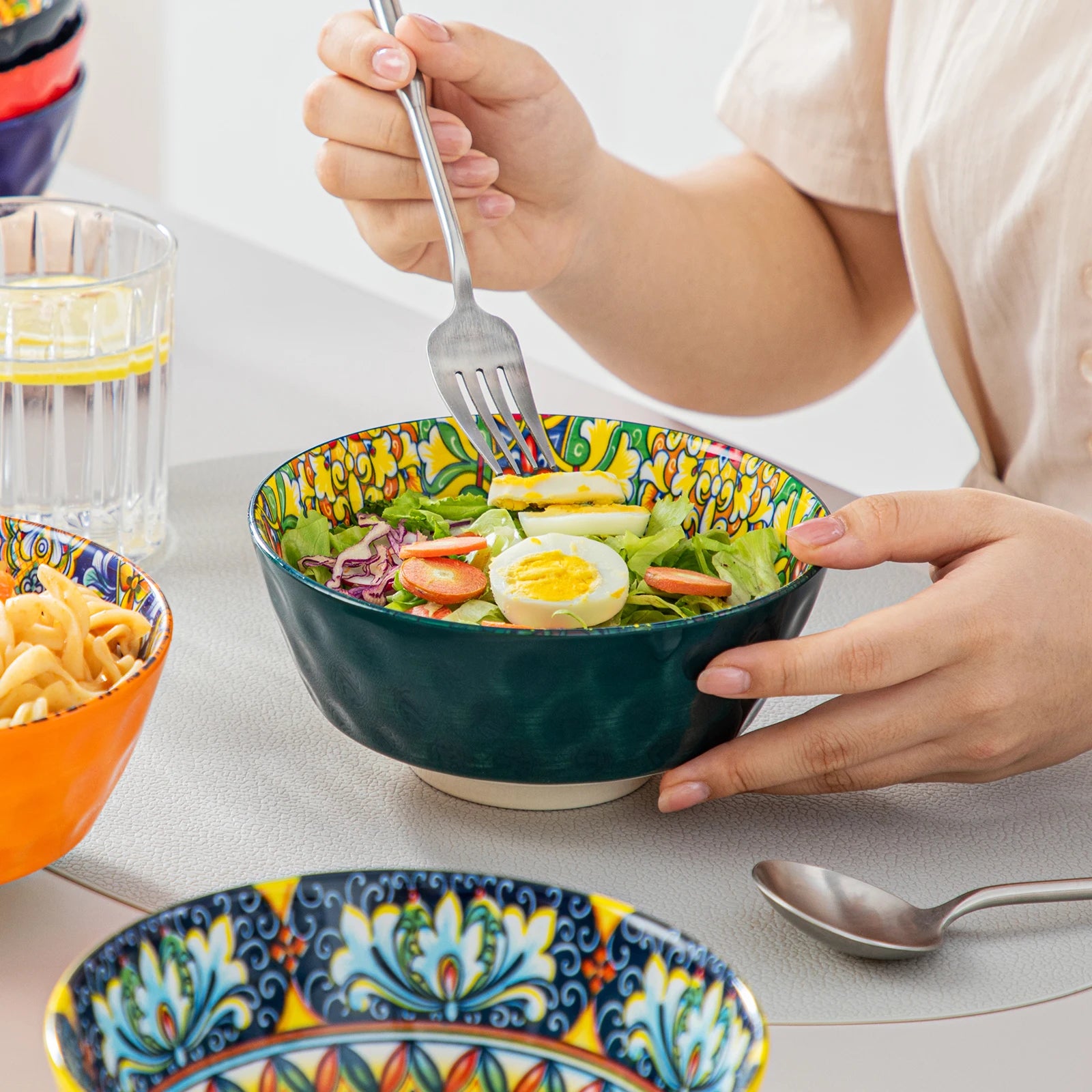 Livoshop 24-piece ceramic dinnerware set with bohemian stoneware design, includes dinner plates, dessert plates, cereal and pasta bowls.