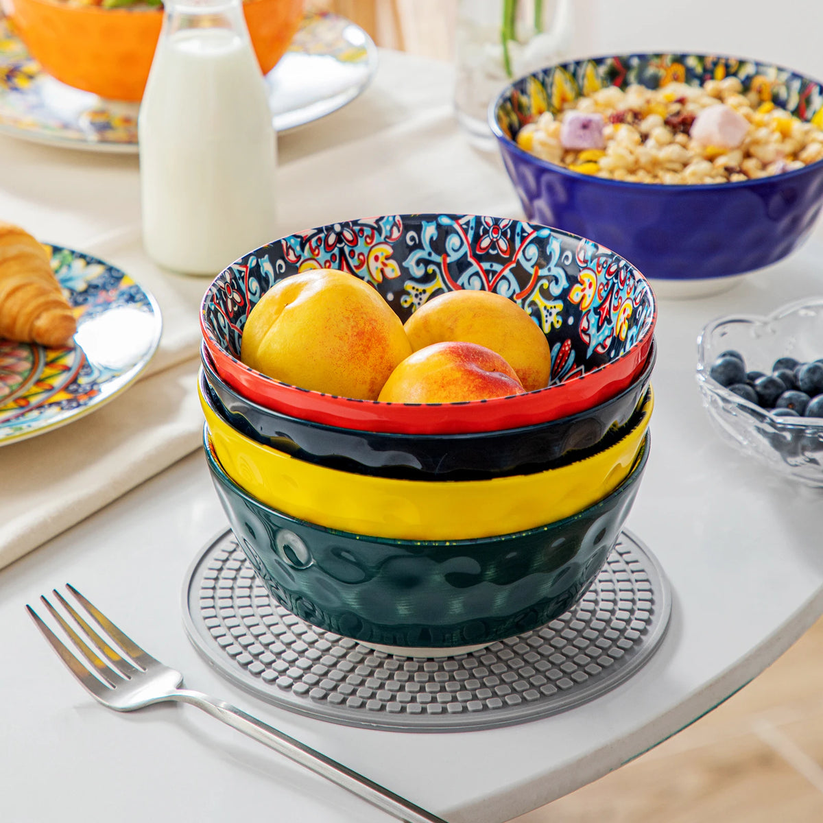 Livoshop 24-piece ceramic dinnerware set with Bohemian style, includes dinner plates, dessert plates, cereal and pasta bowls.
