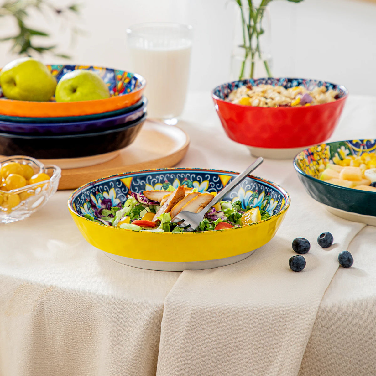 Livoshop 24-piece ceramic dinnerware set with bohemian stoneware design including dinner, dessert, cereal, and pasta bowls