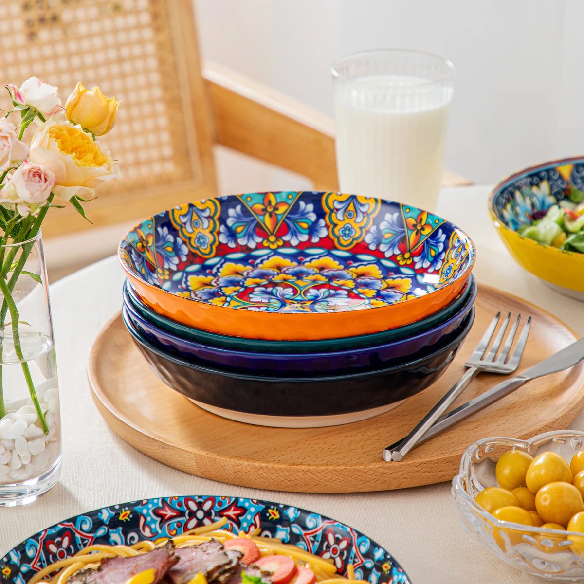 Livoshop 24-piece ceramic dinnerware set with bohemian style, includes dinner, dessert, cereal, and pasta bowls and plates.