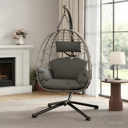 Beige foldable rattan swing egg chair with metal stand, suitable for indoor or outdoor patio and garden use.