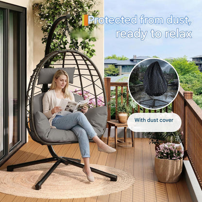Livoshop beige foldable rattan swing egg chair with metal stand, weatherproof indoor outdoor hanging hammock for patio or garden.