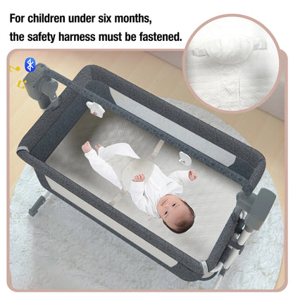 Light grey portable Bluetooth baby crib by Livoshop with auto-rocking and foldable bedside sleeper for newborns.