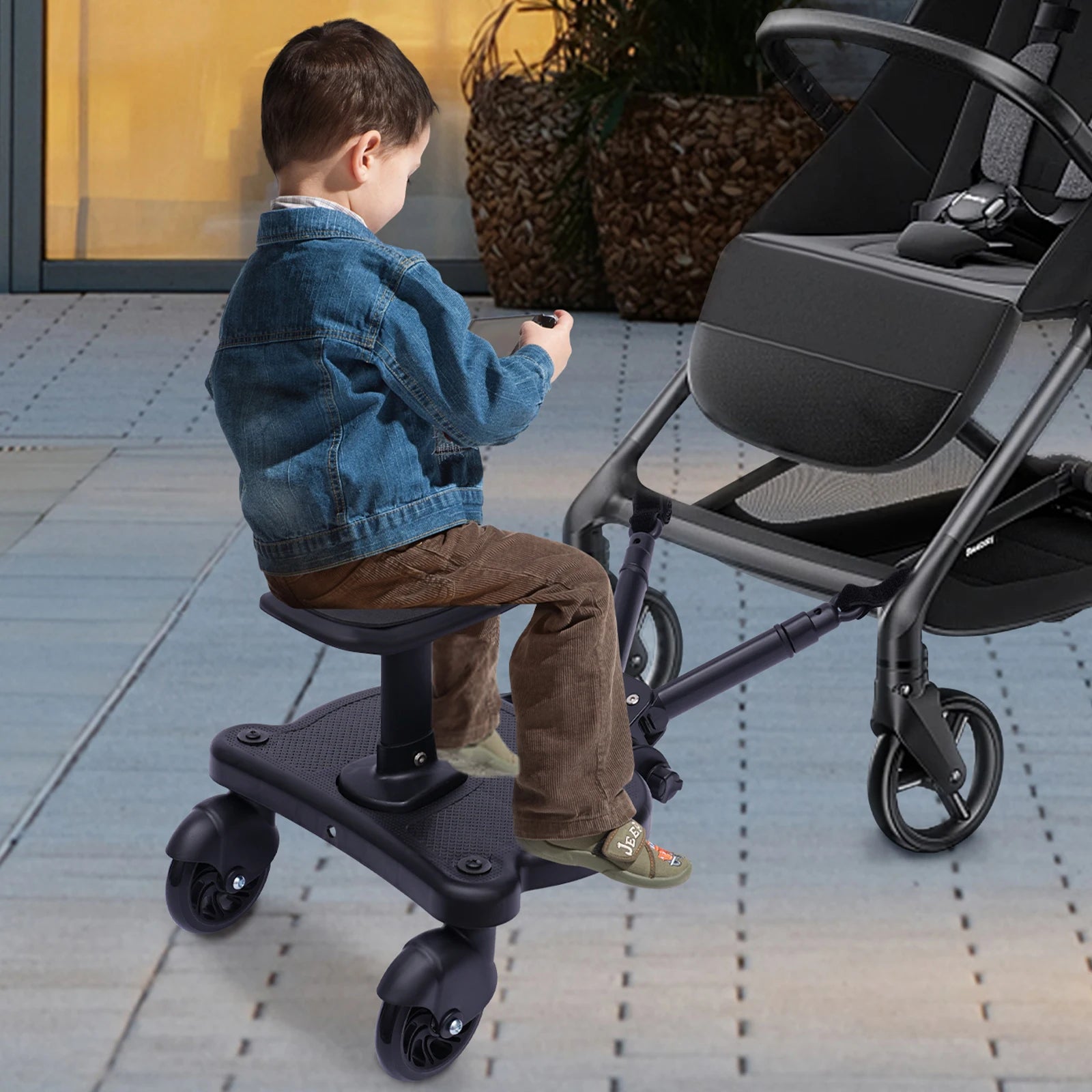 Black Livoshop 2-in-1 universal stroller board with detachable seat, pedal adapter, supports up to 25kg for kids ride and standing.