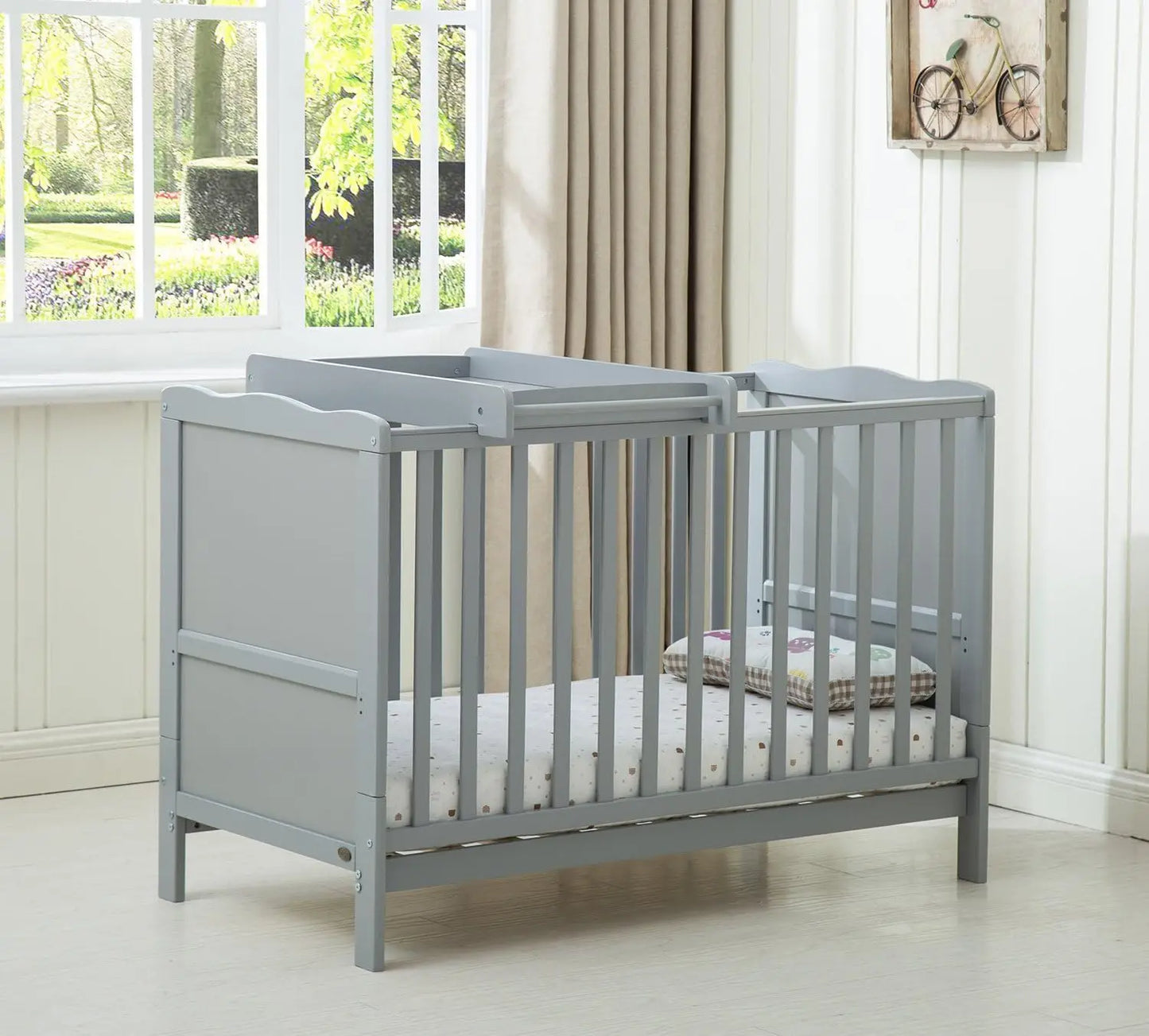Wooden baby cot bed Orlando by Livoshop with top changer and aloe vera water-repellent mattress in grey, suitable for nursery.
