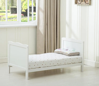 Grey wooden baby cot bed Orlando by Livoshop with top changer and aloe vera water-repellent mattress in a nursery setting.