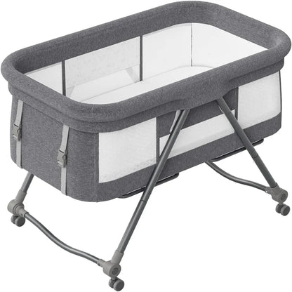 Livoshop 2-in-1 folding baby crib and rocking bassinet in khaki, portable and adjustable for newborns.