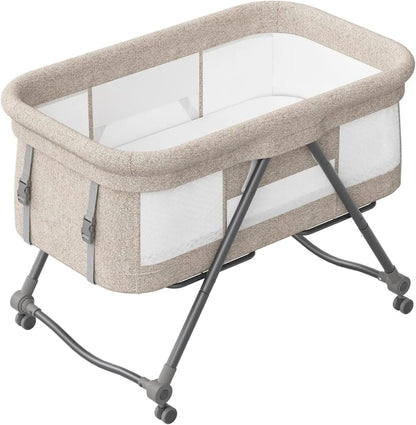Livoshop 2-in-1 folding baby crib and rocking bassinet in khaki, portable and adjustable for newborns.