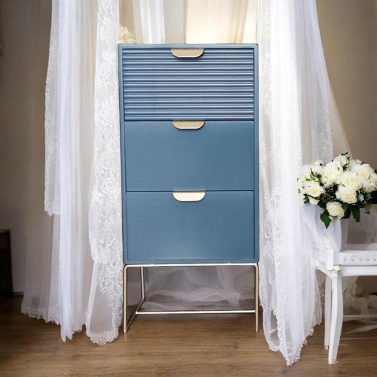 Blue wooden bedside table by MSL with three drawers and scalloped design, perfect for bedroom storage.