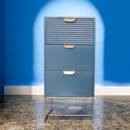 Blue wooden bedside table with three drawers and scalloped design, MSL storage unit for bedroom decor and organization.
