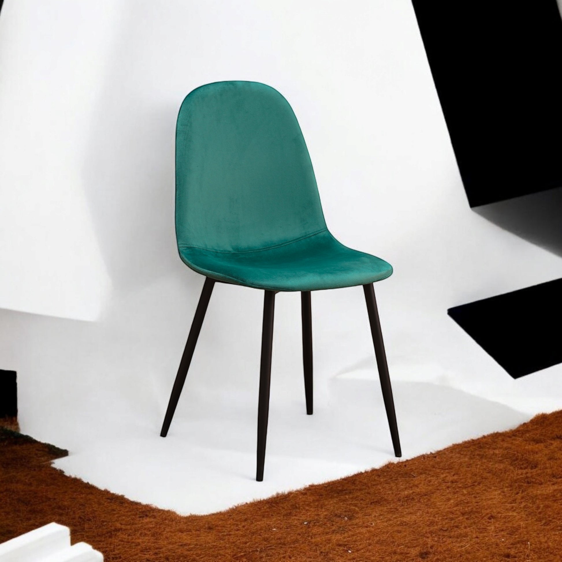 Green fabric chair with black metal legs from MSL, featuring a modern design and comfortable upholstered seating.