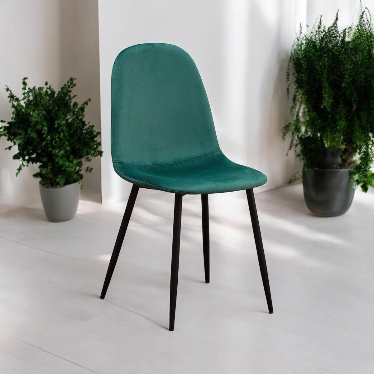 Green fabric chair with black metal legs by MSL, showcasing a comfortable upholstered seat and modern design.