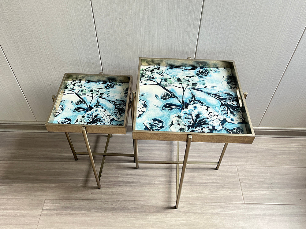 Set of 2 MSL Art Deco nesting side tables with gold floral design and marble effect square tops, stylish and modern home decor.