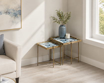 Set of 2 MSL Art Deco nesting side tables with gold floral marble effect square surfaces and sleek modern design.