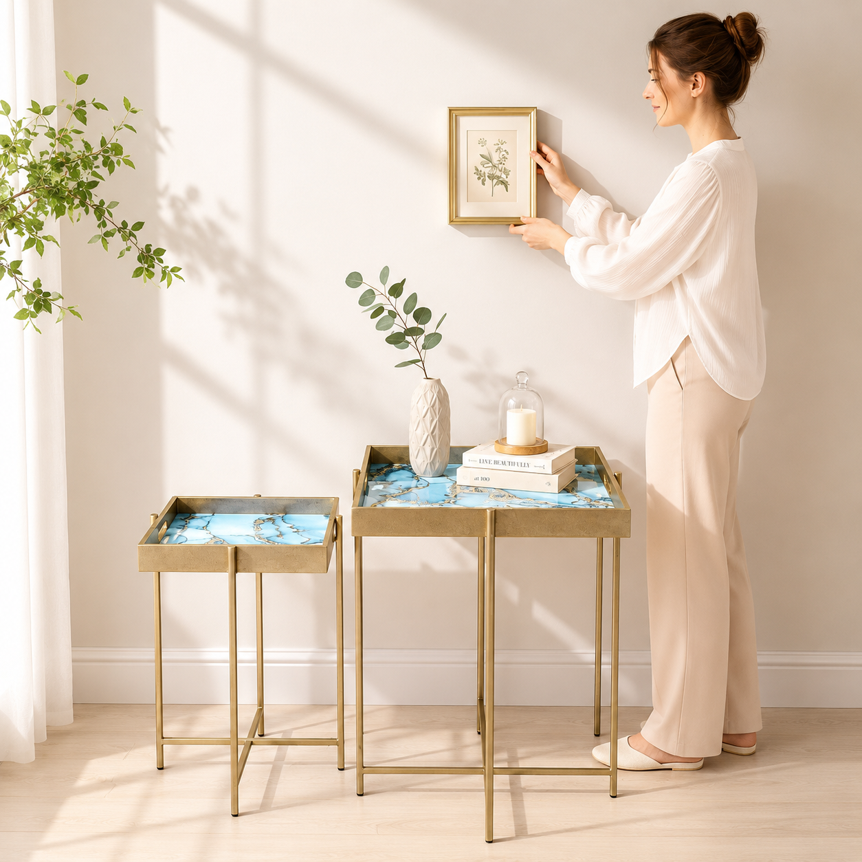 Set of 2 MSL Art Deco nesting side tables with gold floral accents and marble effect square surfaces.