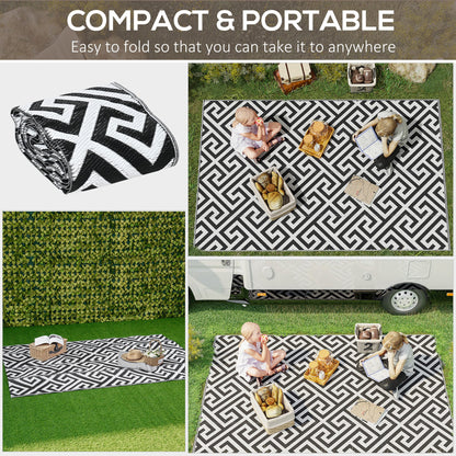Reversible outdoor rug in black, 152x243cm, portable plastic straw camping and garden mat, suitable for outdoor use.