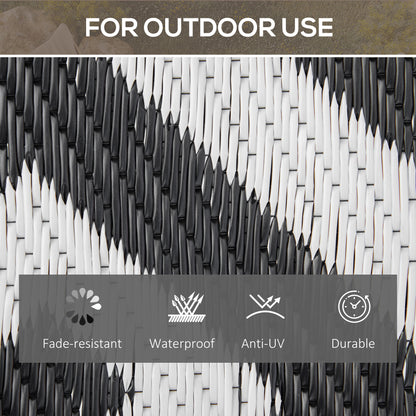 Reversible outdoor rug in black, 152x243cm, portable plastic straw camping and garden mat for outdoor use.