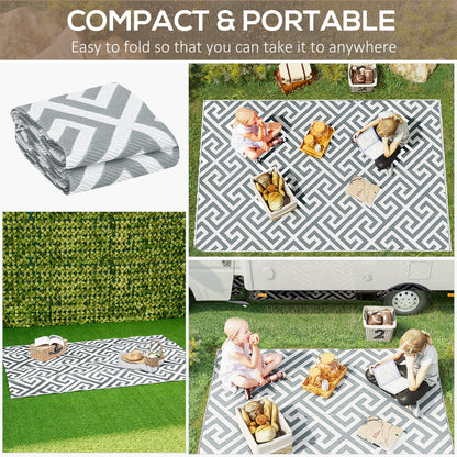 Light grey reversible outdoor rug, 152x243cm, portable plastic straw garden and camping mat for outdoor use.